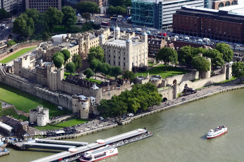 An overview of a large fortress next to a body of water